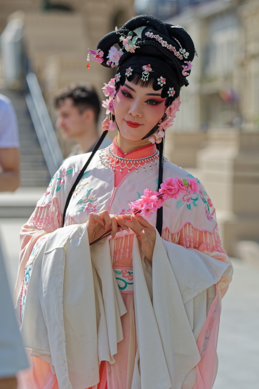 Woman dressed in traditional Chinese opera attire and makeup, likely for a cultural performance or event